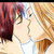 Two anime-style characters with closed eyes kiss, one with red hair and the other with light brown hair, both wearing white tops.