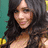 A pixelated image of a person with long dark hair against a teal background, next to red text reading "Vanessa <3".