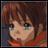 Pixelated anime-style character with brown hair and green eyes, wearing an orange garment, next to stylized text on a black background.