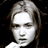 Static 48x48 pixel icon of a person's face with light-colored hair against dark background, rendered in grayscale tones with visible dithering and low-resolution artifacts.