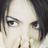 A 48x48 pixel AIM buddy icon featuring a close-up of a person's face on the left and stylized text with a heart symbol on the right, displayed as part of an animated contact sheet.