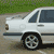 Animated sequence showing a white Volvo 850 sedan in three views: full side, front-three-quarter, and rear-three-quarter with text "Volvo 850" visible.