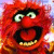 Red furry character with wide eyes and open mouth showing teeth, set against a pixelated background of purple, blue, and orange hues.
