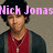 A pixelated image of a person in a red shirt and dark cardigan with pink text overlays reading "Nick Jonasplus Nikki" and "= LOVE".