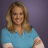 Static 48x48 pixel icon showing a person with long brown hair wearing a blue top against a purple background, rendered in low-resolution pixel art style.