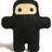 A pixelated character in a black suit with a beige face appears in , with text overlays changing across frames and a walrus-like creature in the final frame