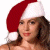 A pixelated image of a person wearing a red and white Santa hat against a split background with green text reading 'Original Icons .com'.