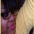 A person with dark hair and glasses rests against a light yellow knitted fabric, showing subtle facial expression changes across frames.