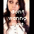 Pixelated image of a person with long dark hair wearing a white top, overlaid with pixelated text reading "i dont wanna wait" in lowercase.