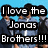 A pixelated image of four young men in blue and dark clothing against a light blue background with overlaid text reading "I love the Jonas Brothers!!!".