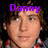 A pixelated image of a person with brown hair wearing a red and white checkered shirt, overlaid with purple text reading "Danny my little hottie :]".