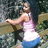 A pixelated image of a person in a pink top and blue shorts leaning against a stone structure, with red background text reading "U KNO U WNT MEHH" and "I am ur babii n".