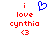 Red pixelated text 'i love cynthia <3' with a blue heart symbol above the text on a white background.