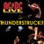 AC/DC logo and 'HUNDERTSTUCC' text appear above a of metallic objects, with one object changing from dark to light in the animation