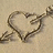 A static image with a heart-shaped drawing on sand and pink text phrases about living, laughing, loving, forgiving, forgetting, and enjoying life.