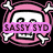 Pixelated icon with pink skull and crossbones border, text overlays including 'SASSY SYD', 'GOTH GIRL', 'PUNK', and 'icon by Brooke B' on black background.
