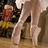 A pixelated image of a dancer's legs in ballet shoes on stage with text overlay reading 'i dance like nobody's watching' against a coral background.