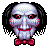 Pixelated character with pale face, red cheeks, black hair, and red bow tie against gray background.