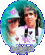 Two people in a circular frame with teal border; one wears a light blue cap with pink flower, the other has long dark hair; the cap's flower changes from pink to red to purple across frames.
