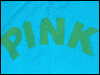 Green text spelling 'PINK' on a blue background with visible pixelation and slight blurring.