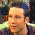 Animated sequence showing three distinct head-and-shoulders portraits of individuals in a with visible pixelation
