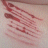 repeated pinkish-red striped patterns with changing text labels , showing animation progression