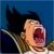 A pixelated close-up of a character with dark hair against a blue background, mouth open in a shout or yell.