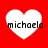Four white heart shapes on a red background, each containing the text 'michaela' in black pixelated font.