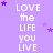 Purple background with repeated white text 'LOVE the LIFE you LIVE' and scattered purple stars.