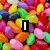 Colorful jelly beans fill the top-left quadrant, a red heart outline with 'Love' text occupies the top-right, and 'Being Random!' text appears over a grayscale background in the bottom-left.