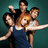Five pixelated figures in dynamic poses against a teal background, with one figure holding a white object resembling a sword.