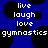 Blue background with black circular shapes and white pixelated text reading live laugh love gymnastics repeated across the image.
