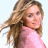 A 48x48 pixel buddy icon featuring a woman with long wavy hair in a pink top on the left and "NEW YORK MINUTE" text blocks on the right, displayed as a static contact sheet frame.