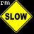 Yellow diamond-shaped 'SLOW' sign with black border on black background, surrounded by yellow text fragments and gray rectangle.