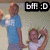 Two people in a light blue and white shirt pose with a heart-shaped hand gesture, while a black text box with 'btf :D' appears above them.
