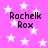 A static image with a bright pink background filled with white stars, displaying four identical text blocks reading "Rachek Rox" in black pixelated font.
