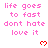 Pixelated pink text reads 'life goes to fast dont hate love it' with red heart symbols on a white background.