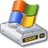 A pixelated USB flash drive with four colored cylindrical caps on top, resting on a white surface with visible ports and a metallic casing.