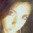 A pixelated image with a purple background, yellow text, and a partial face on the left side.