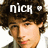 Pixelated image of a person with dark curly hair wearing a black cap, white text 'nick' and heart symbol above head.