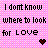 Pixelated text on a pink and white checkered background with a small red heart icon in the bottom right corner.