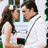 A pixelated image shows a man and woman in close proximity, the woman with long brown hair and the man with dark hair, both facing each other.