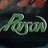 Green cursive text spelling 'Ryuu' on a dark background with blurred red and green tones above.