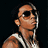 Pixelated image of a person with light brown skin wearing dark sunglasses and white earphones, viewed from the side against a black background.