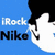 Blue background with white 'iRock' text and black 'Nike' text, a stylized cartoon head with black hair and white face, and a grayscale skateboard with blue wheels.