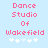 Pixelated text "Dance Studio Of Wakefield" in pink on light blue background with white snowflake symbols below.