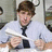 A pixelated image of a person in a light blue shirt and dark tie holding papers, with text reading "i love" above and "jim halpert" below.