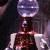 A 50x50 pixel animated buddy icon featuring a character with a large spherical head and dark body against a green background with "Original Icons .com" text.