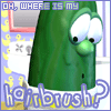 Green anthropomorphic vegetable character with large eyes and nose, holding a white object, against a blue background with yellow anchors and a mirror.