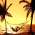 Animated contact sheet of a tropical beach scene with palm trees and water, featuring a pink heart icon that changes shape across 14 frames.